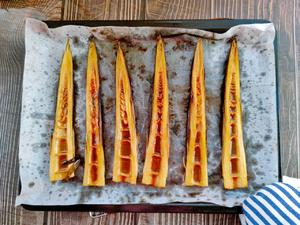 Remove the roasted bamboo shoots from the oven.