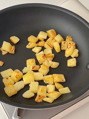 Pan-fry the potatoes with a little oil until golden on the surface