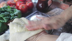 Spread the olive oil on the smooth dough