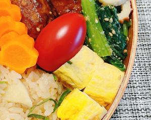 Simmered egg custard (rolled omelette) and cherry tomatoes.