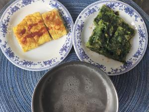 Egg rolls with steamed spinach pancakes and grain soy milk.