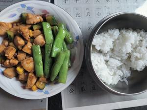 Kung Pao chicken with stir-fried green beans over rice.