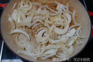 Add the onions and continue to sauté over medium-low heat until they become soft and translucent.