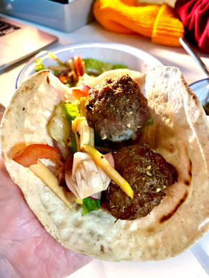 Step 4: Mix ingredient 4 with any salad dressing; I used Italian balsamic vinaigrette. Fill a pita with two meatballs and a generous amount of onion salad. It's super exotic—give it a try!