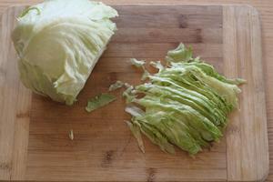 While the pork cutlets are baking, you can prepare some shredded lettuce or cabbage (green cabbage).