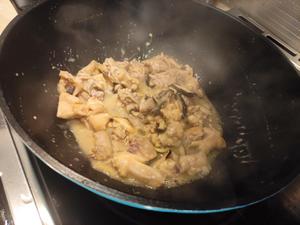 Add the marinated free-range chicken and stir-fry until it's about 70% cooked before removing from heat.