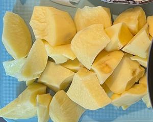 Chop the potatoes (using a knife to make an incision and then breaking off a piece 😂). I’m not sure if it’s psychological, but the irregular shapes seem to make them taste better than perfectly uniform pieces.