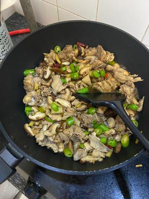 Add the green chili and continue to stir-fry; you can add a little hot water to prevent sticking.