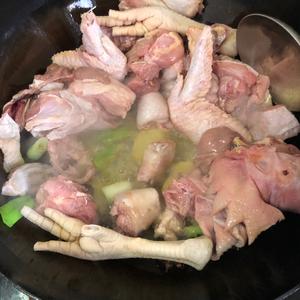 Once the oil is hot, add the green onion, ginger, star anise, and Sichuan peppercorns and sauté until fragrant, then add the chicken.