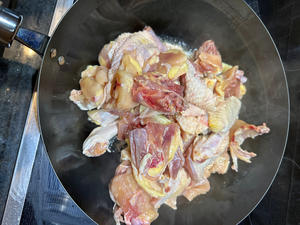 Add the chopped chicken to the pan and stir-fry until oil is released.