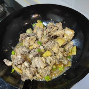 Add a generous scoop of soy sauce and half a scoop of cooking wine. Stir-fry for a bit longer (this step is crucial for stir-frying the chicken).