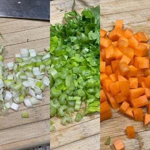 Remove the oxtail and strain the soup to discard the vegetables. Return the broth to the pot and add chopped carrots, celery, and green onions along with the oxtail. Simmer together for about 10 minutes.