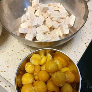 Peel the chestnuts, using small cone-shaped ones. If you have flat chestnuts, cut them in half (this helps them cook evenly when stir-fried). Peel and chop the taro into small pieces.