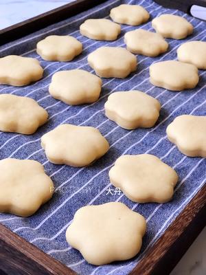 Let them rise for about 50 minutes, adjusting based on room temperature. The dough should visibly expand and feel light.