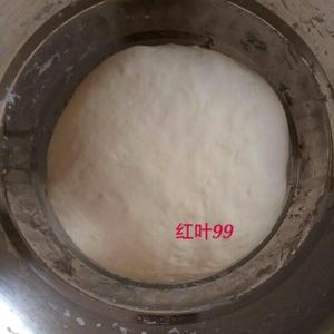 Now prepare the dough by mixing flour with warm water just below body temperature. Knead until the dough is smooth. The dough for dumplings should be slightly soft and not too dry. Cover with plastic wrap and let it rest for 20 minutes.