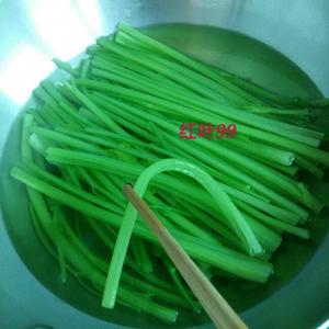 Wash the celery and cut it into sections, blanching it in boiling water until it slightly softens, then remove from heat. Avoid overcooking to preserve the celery's flavor.