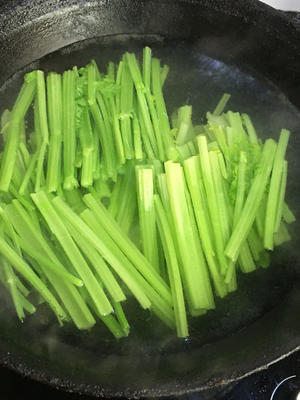 Bring a pot of water to a boil and blanch the celery.