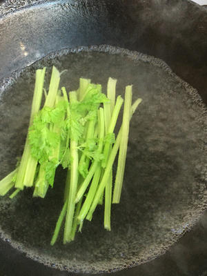 Boil water in a pot over high heat and blanch the celery.