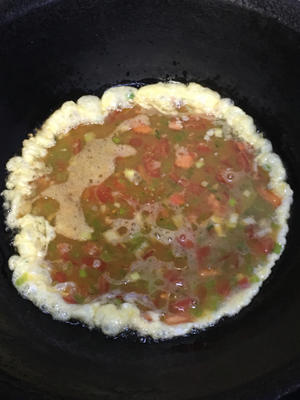 Heat oil in a pan. Once hot, pour in the egg mixture without stirring.