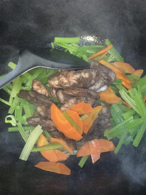 Add the celery, carrot, and dried sausage; stir-fry on high heat for one minute.