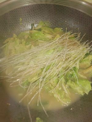 Add the chopped cabbage and vermicelli, cover, and simmer on low heat.