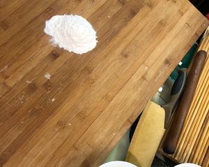 Sprinkle flour on the cutting board.