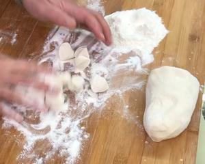 Sprinkle flour on the small pieces of dough.