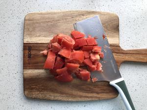 Peel and chop the tomatoes.