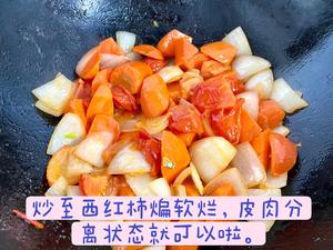 Continue to stir-fry until the tomatoes soften and release their juice, separating skin from flesh.