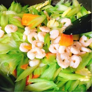 Once the celery turns a bright green, add the blanched shrimp, stir-fry again, and add a pinch of salt and a tablespoon of oyster sauce (you can skip the oyster sauce if you prefer the natural flavor).