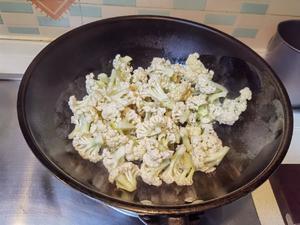 Add the cauliflower and stir-fry until tender; then remove and set aside.