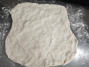 Turn out the dough, gently stretch it up, down, and side to side.