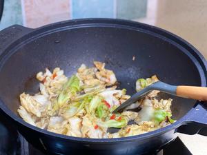 Stir-fry until the cabbage is soft and well-seasoned.