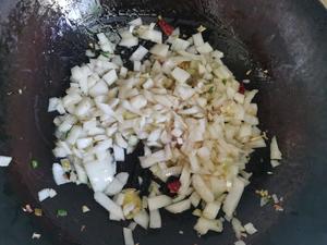 Add the diced onion and stir-fry until soft.